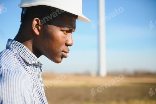 Preview: African American worker in a construction helmet