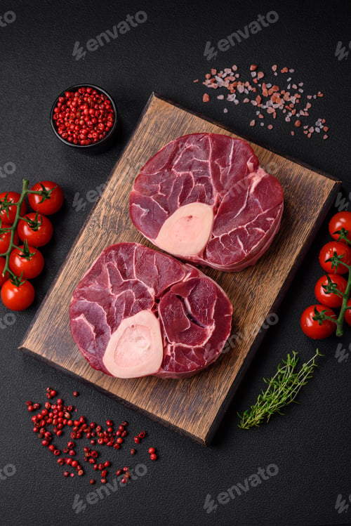 Preview: Fresh raw beef steak with bone or ossobuco with salt, spices and herbs