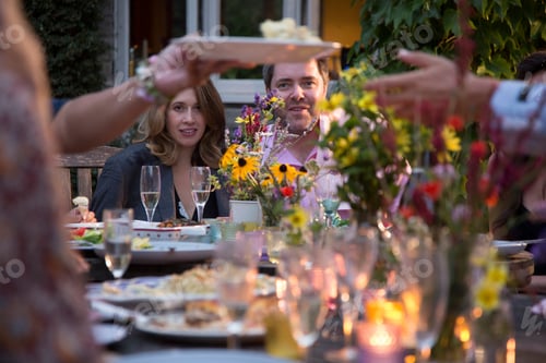 Preview: Guests enjoying and celebrating at garden party