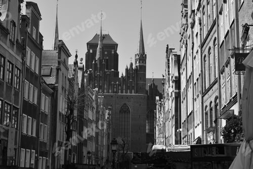 Preview: Black-and-white view of historic buildings and a church in Poland.
