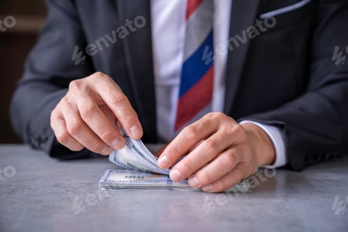 Preview: businessman counts money in hands. savings, finances, economy and home concept - close up of man cou