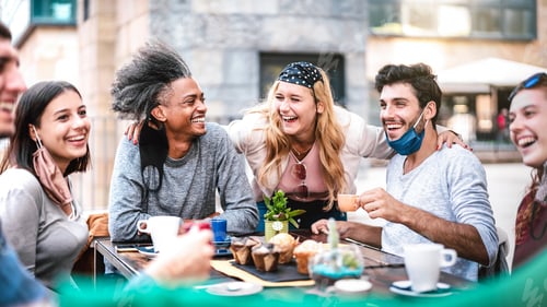 Preview: Multiracial people having fun drinking at outside coffeehouse