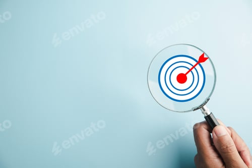 Preview: Target board inside magnifier glass for focus business objective