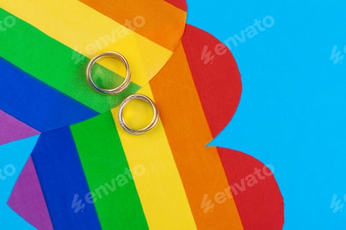 Preview: Gay Marriage Concept with Rainbow flag and rings