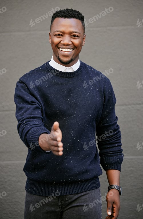 Preview: Closeup Portrait of a young african american businessman holding his hand out for a handshake in a