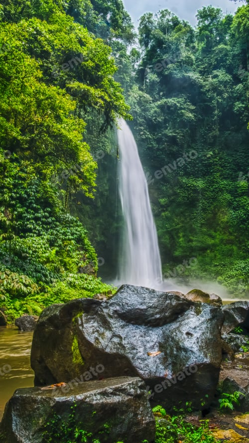 Preview: Amazing Nungnung waterfall, Big stone in front, Bali, Indonesia
