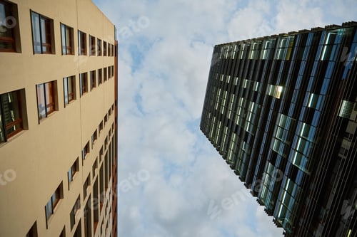 Preview: Two buildings facade against sky