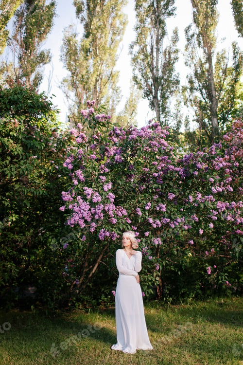 Preview: Woman in a White Dress in a Flower Garden