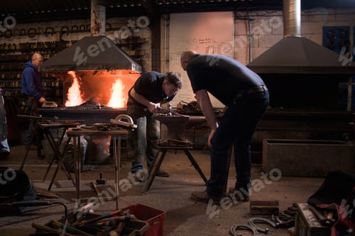 Preview: Farriers forging horseshoe on anvil