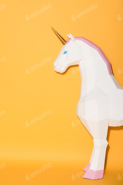 Preview: partial view of decorative unicorn standing on yellow background