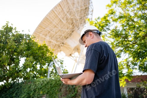 Preview: Engineer looking earth based astronomical radio telescope