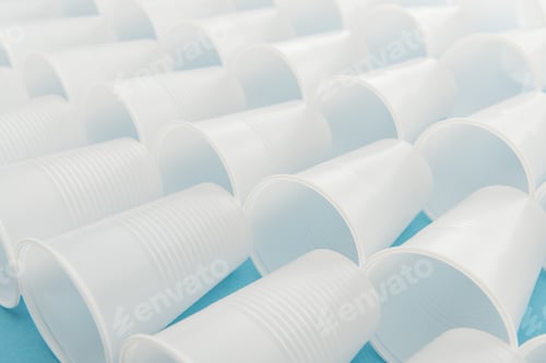 Preview: selective focus of white and plastic cups with copy space