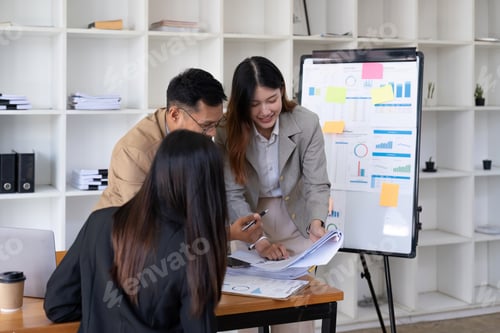 Preview: A group of business people are meeting to analyze data for marketing plan.