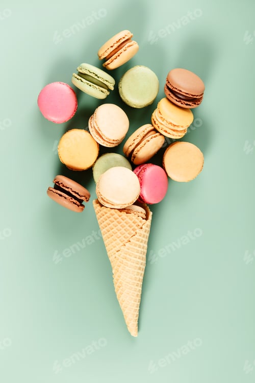 Preview: Colorful Macarons in Ice Cream Cone on Pastel Background