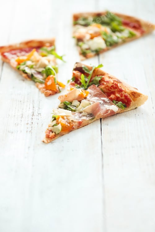 Preview: Appetizing Slices of Pizza Topped with Ham and Greens