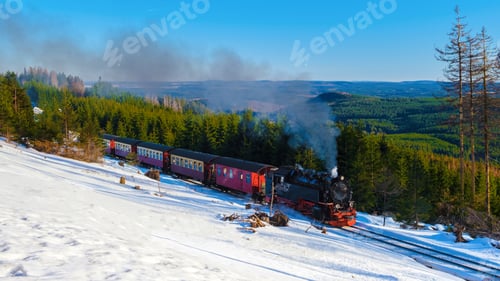 Preview: Steam train during winter in the snow in the Harz Germany Brocken Bahn