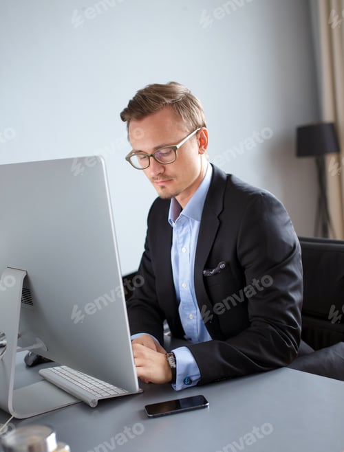 Preview: Young business man in office.