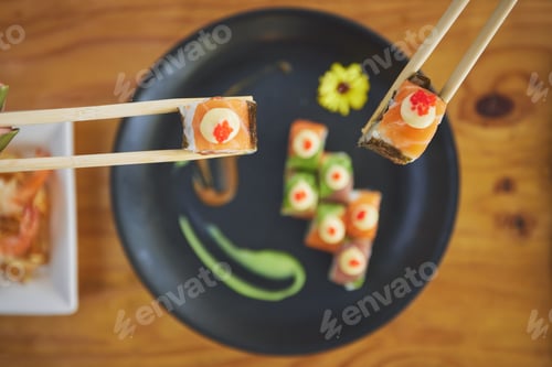 Preview: Sushi, seafood and chopsticks in a chinese restaurant fro above for dining or traditional cuisine.