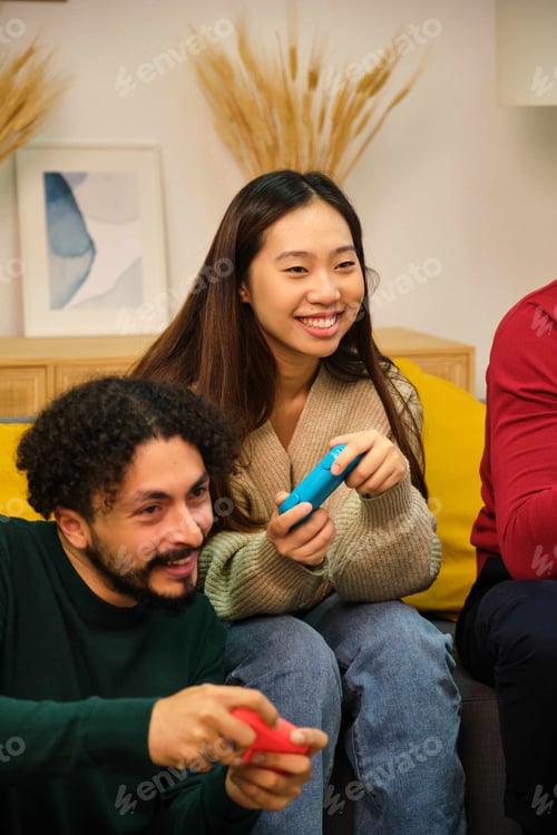 Preview: Multiracial friends playing video games in shared apartment.