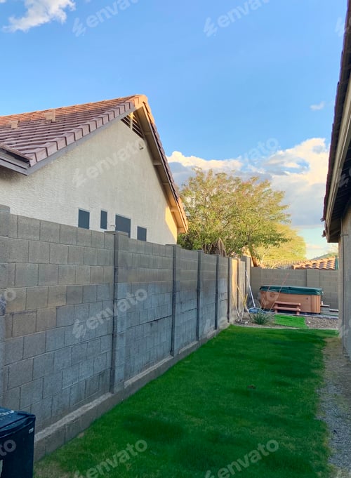 Preview: Water damage on a concrete block fence