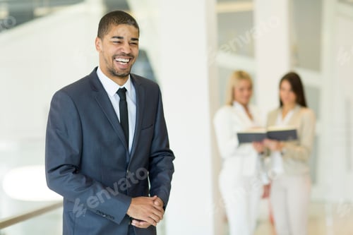 Preview: Young multiracial people working in the office
