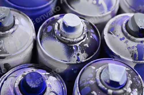 Preview: A lot of used spray cans of paint close-up. Dirty and smeared cans for drawing graffiti
