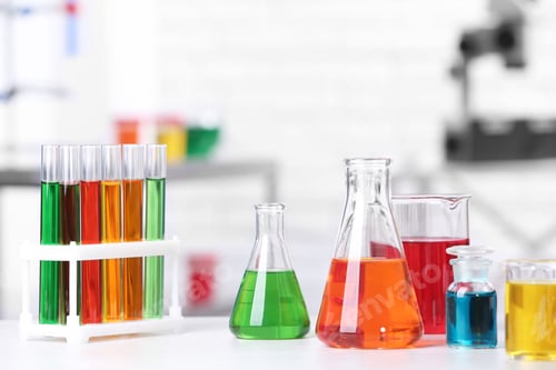 Preview: Different glassware with samples on table in chemistry laboratory