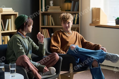 Preview: Two Teenagers Engaging in Group Therapy Session and Sharing Experiences