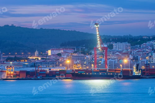 Preview: View of Lisbon port with ship and port cranes in the evening
