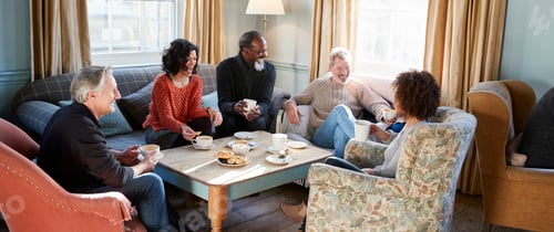 Preview: Group Of Middle Aged Friends Meeting Around Table In Coffee Shop