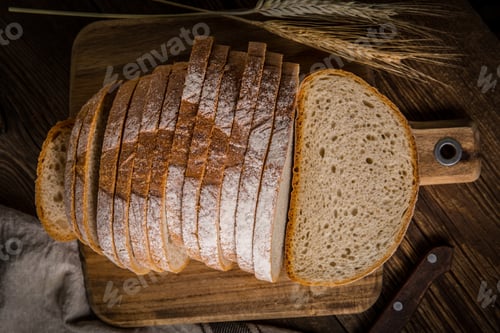 Preview: Sliced loaf of bread on a chopping board.