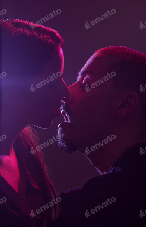 Preview: Young Adult Caucasian, Straight (Heterosexual) Couple Sensual Almost Kissing. Studio Shot. Colorful
