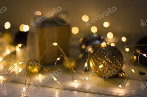 Preview: Christmas decoration with fir tree, gift box, garland lights, toys. Winter holidays, Merry Christmas