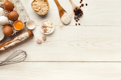 Preview: Baking background with eggs and flour on white rustic wood