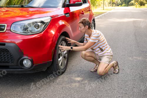 Preview: Woman stands near a broken car after an accident. call for help. car insurance.woman feeling