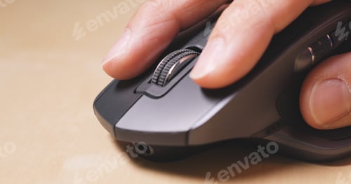 Preview: Man use of computer mouse on table