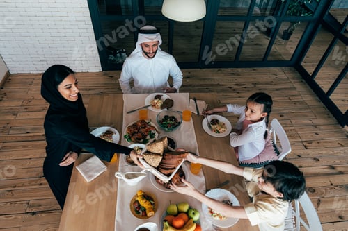 Preview: Traditional arabian family from Dubai spending time together at home