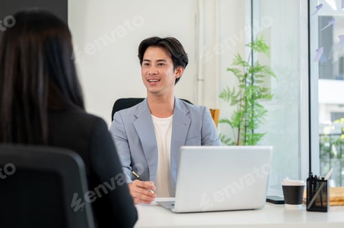 Preview: A confident and friendly Asian businessman or CEO is interviewing a female candidate in his office.