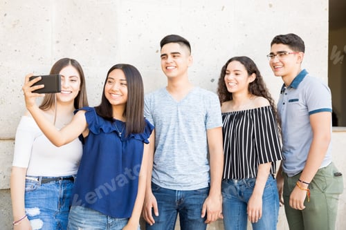 Preview: Teenagers taking selfie outdoors