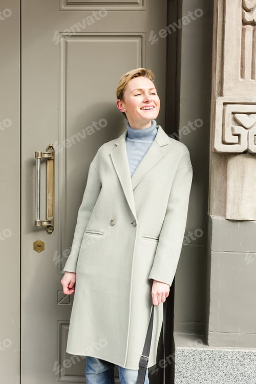 Preview: Elegant and stylish adult businesswoman in financial city district.