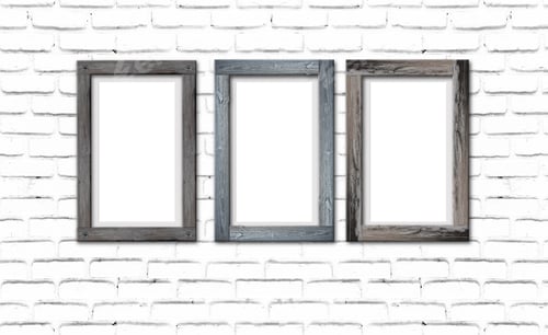 Preview: Collection of brown wood frames on brick wall. For interiors decor mockup