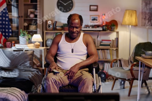 Preview: Retired Black Man Spending Evening Indoors Watching Television