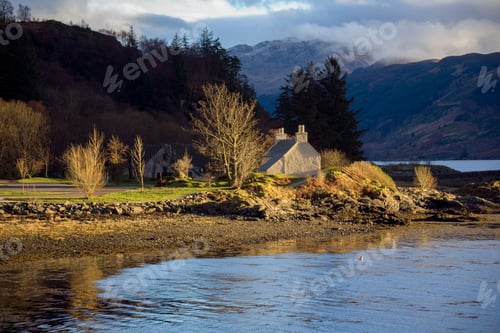 Preview: Evening sunlight on a country cottage on the banks of Loch Duich in the northwest of Scotland.