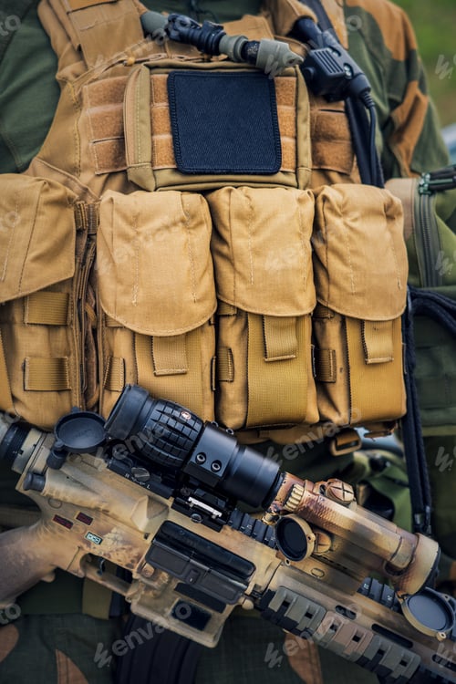 Preview: Soldier with an assault rifle wearing a tactical load-carrying vest