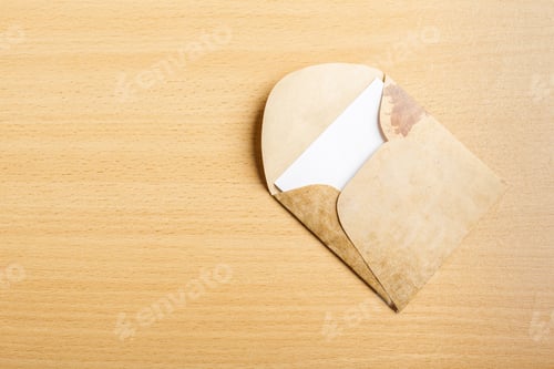 Preview: envelope whit blank on wooden table