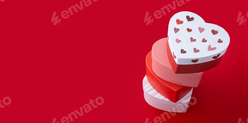 Preview: Set heart shaped boxes decorated with pink and red hearts on red background