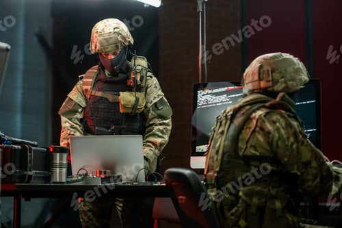 Preview: Cybersecurity Specialists Working on Computers in Dark Room