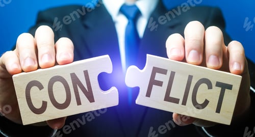 Preview: Man breaks puzzles with word Conflict. Resolution of disputes and conflicts in negotiations. Come to