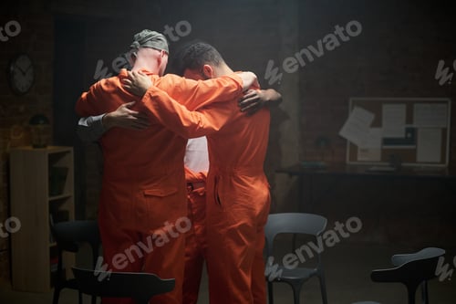 Preview: Diverse Young Adult Men Embracing during Group Therapy Session in Prison