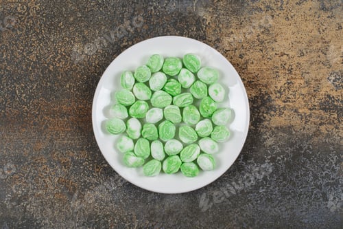 Preview: Green menthol candies on white plate